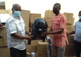kyei mensah presents equipment to barbers